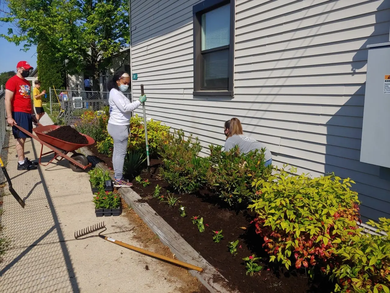 team installing a garden bed 